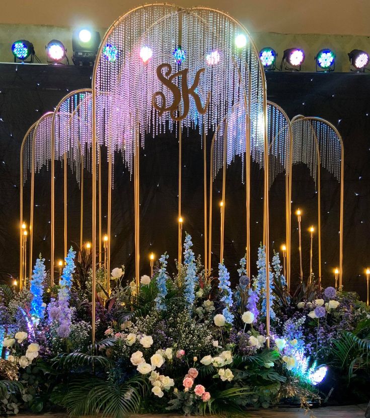 an elaborate floral display with lights and chandeliers