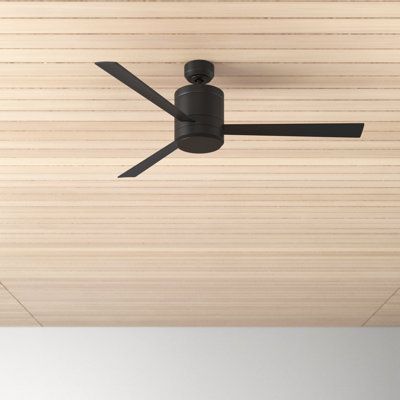 a ceiling fan mounted to the side of a wooden ceiling with black blades on it