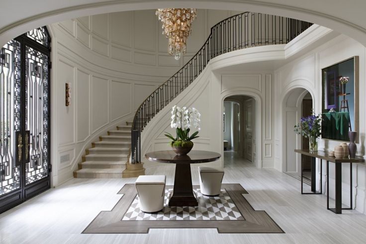 the foyer is decorated in white and black