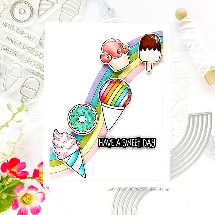 a card with an ice cream cone, donuts and rainbows on it that says have a sweet day