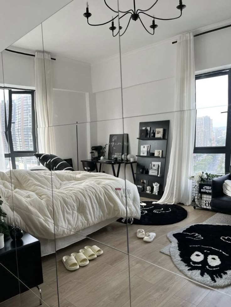 a bedroom with mirrored walls and flooring in the middle is seen from across the room