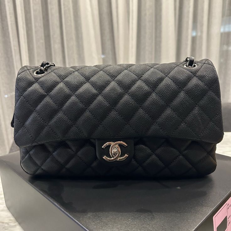 Chanel Single Flap Bag From The 2014 Cruise Collection. Interlocking Cc Logo, Caviar Leather, Quilted Pattern, Silver Hardware & Chain-Link & Leather Shoulder Straps, “Cc” Turn Lock Closure At Front, Zip Closure Beneath Front Flap, Grey Woven Canvas Lining & Single Pocket At Interior Wall W/ Zip Closure. Includes Original Box & Dust Bag. Chanel Authenticity Card With Serial Number. Used A Handful Of Times, Looks Brand New! Silver-Tone Hardware Chain-Link Shoulder Straps Bought At Saks In Greenwi Black Double Flap Bag For Business, Black Double Flap Business Bag, High-end Black Flap Bag With Dust Bag, Black Double Flap Bag With Removable Pouch, Black Double Flap Shoulder Bag, Chic Black Double Flap Bag, Designer Black Flap Bag With Chain Strap, Everyday Luxury Black Textured Leather Shoulder Bag, Black Textured Leather Shoulder Bag For Everyday Luxury