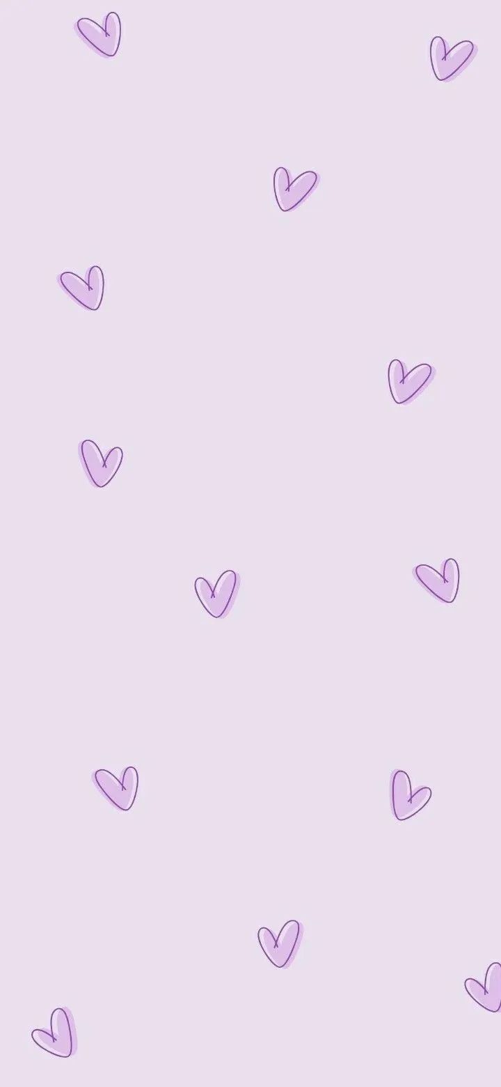 purple hearts are flying in the air on a light pink background with small white dots