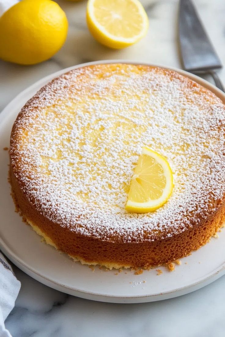 a lemon cake with powdered sugar on top