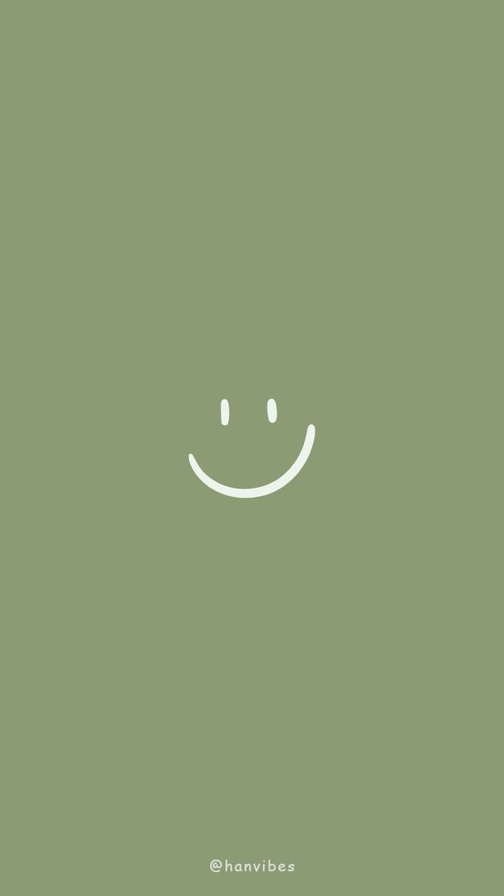 a green background with a smiley face drawn on it