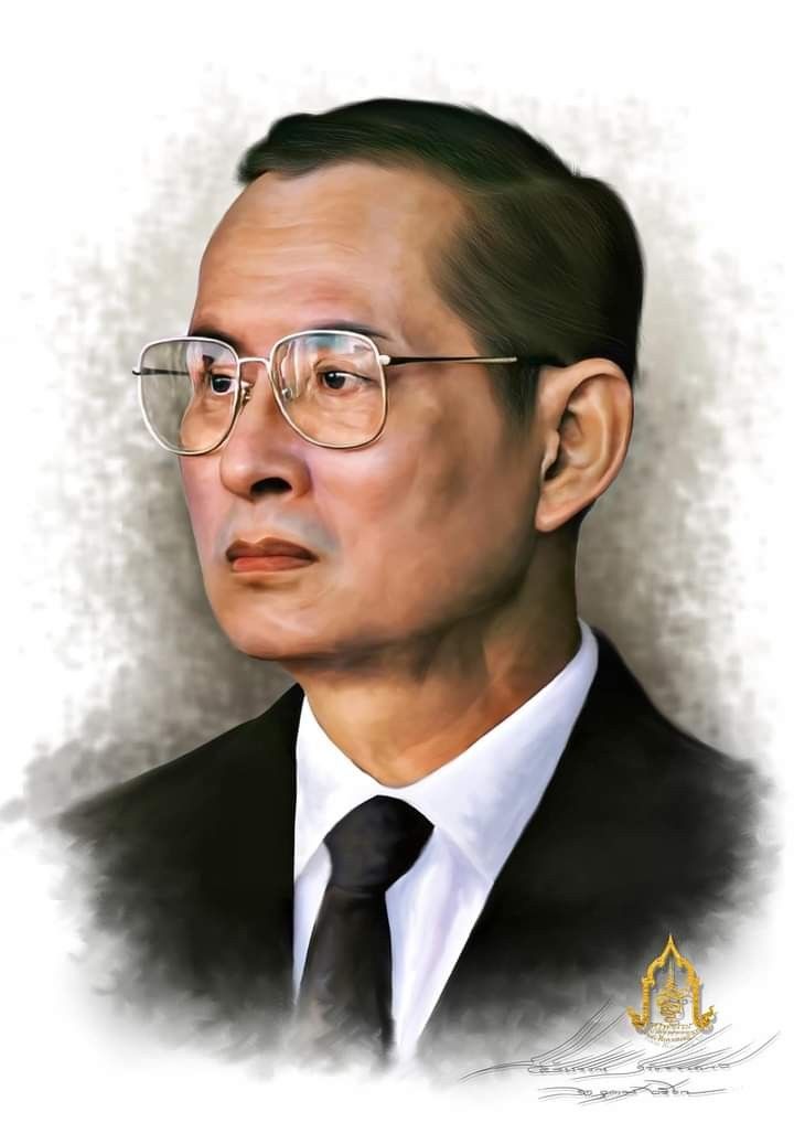 a portrait of a man wearing glasses and a suit