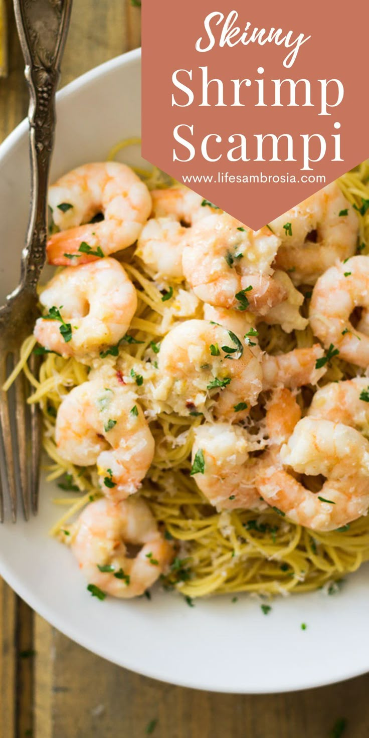 shrimp scampp pasta on a white plate with a fork