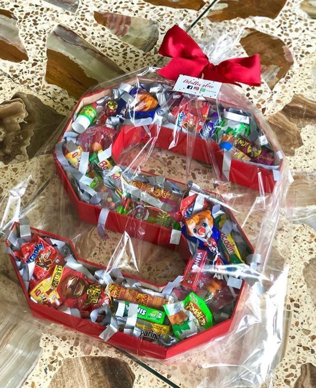 the letter e is made out of candy and wrapped in plastic