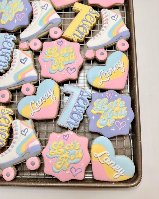 cookies decorated with ice skates and the words i love you on them are sitting on a cooling rack