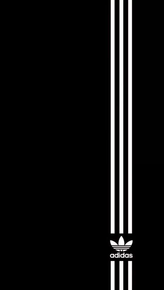 the adidas logo is shown in black and white on a dark background with vertical stripes