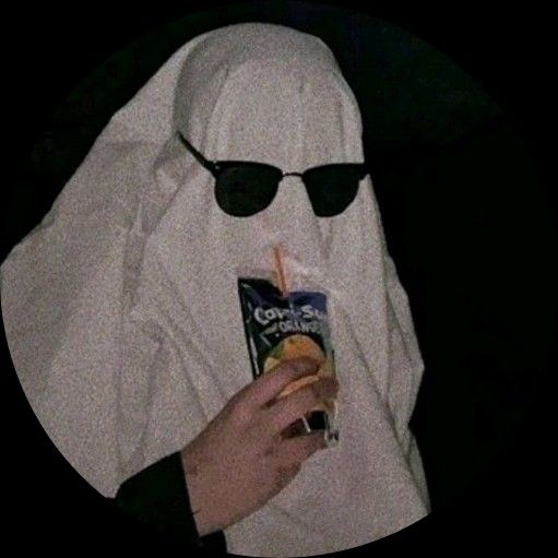 a person in a white nun costume holding a bag of chips and a drink while wearing sunglasses