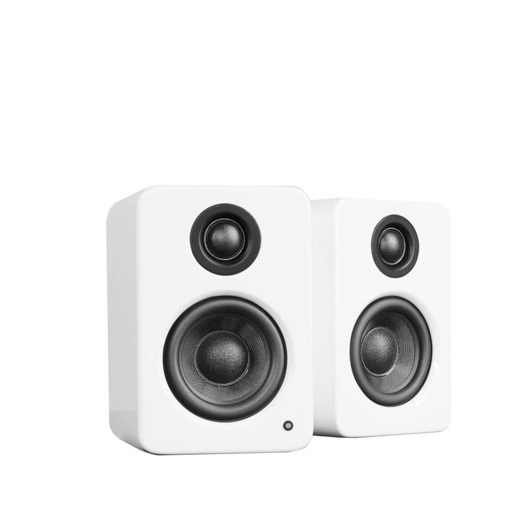 two white speakers sitting next to each other