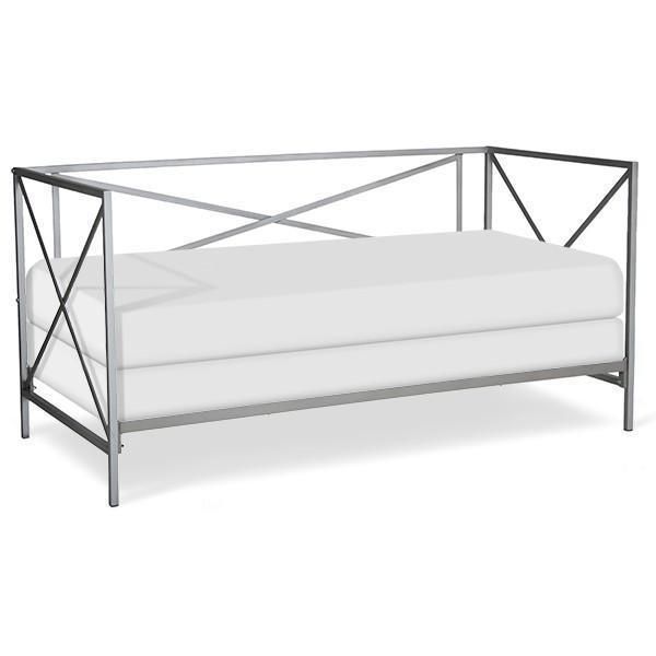 a metal frame daybed with white sheets and pillows on the bottom, in front of a white background