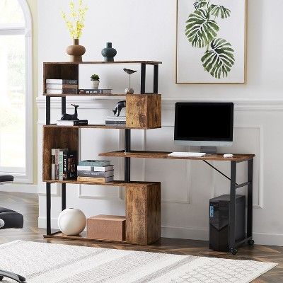 a computer desk sitting on top of a wooden shelf next to a chair in a living room