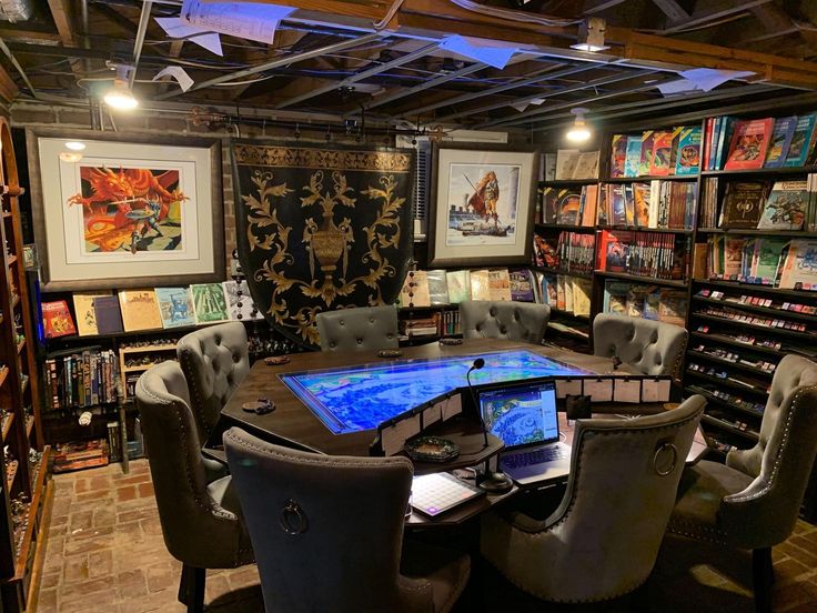 a room with chairs, tables and bookshelves full of books