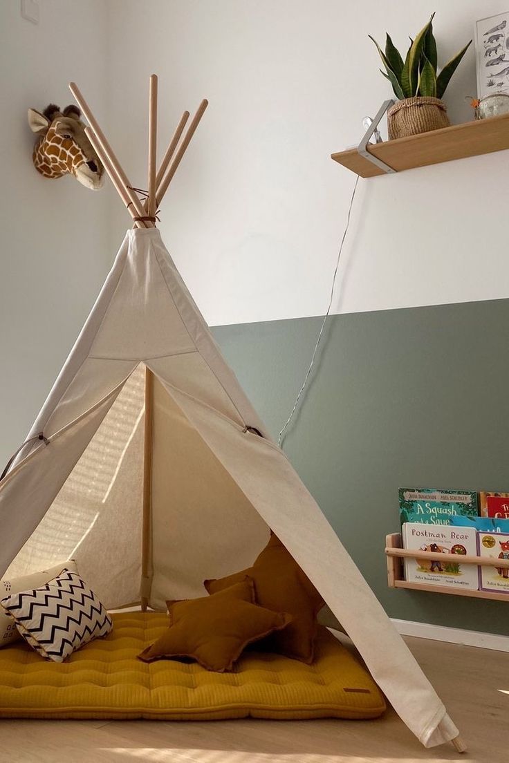 a child's teepee is set up on the floor