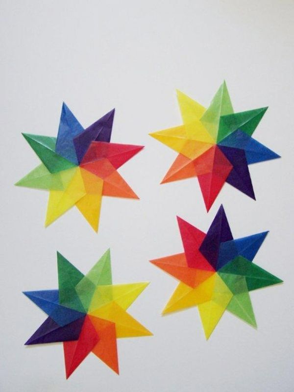 four different colored paper stars arranged in a circle