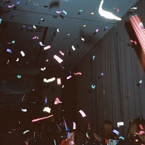 confetti and streamers are falling from the ceiling