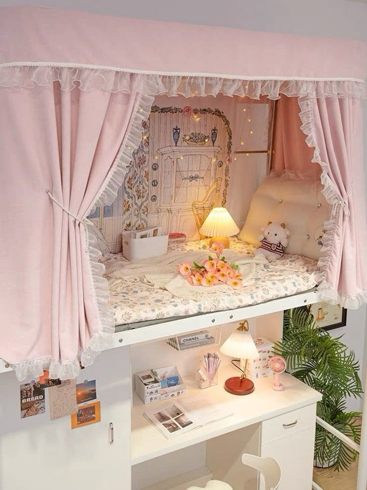 a doll house is shown with pink curtains