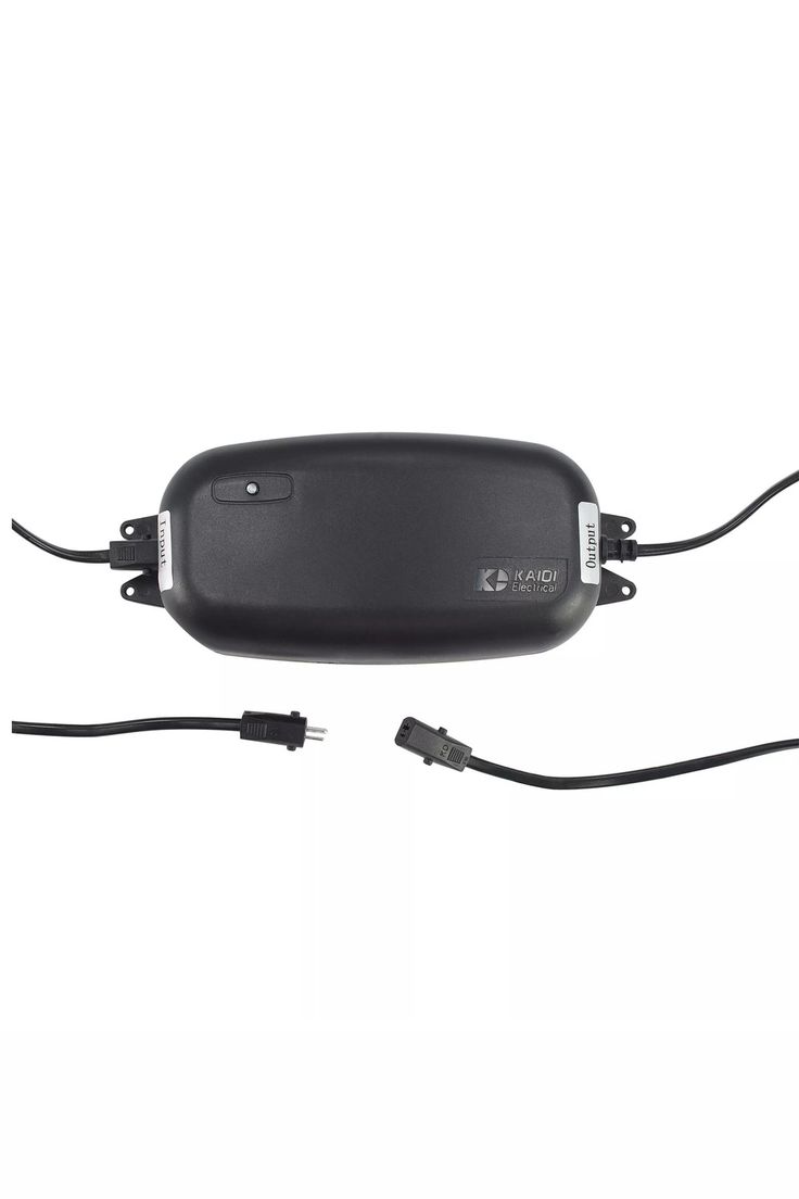 the back side of a car mirror with two wires connected to it and an electronic charger plugged in