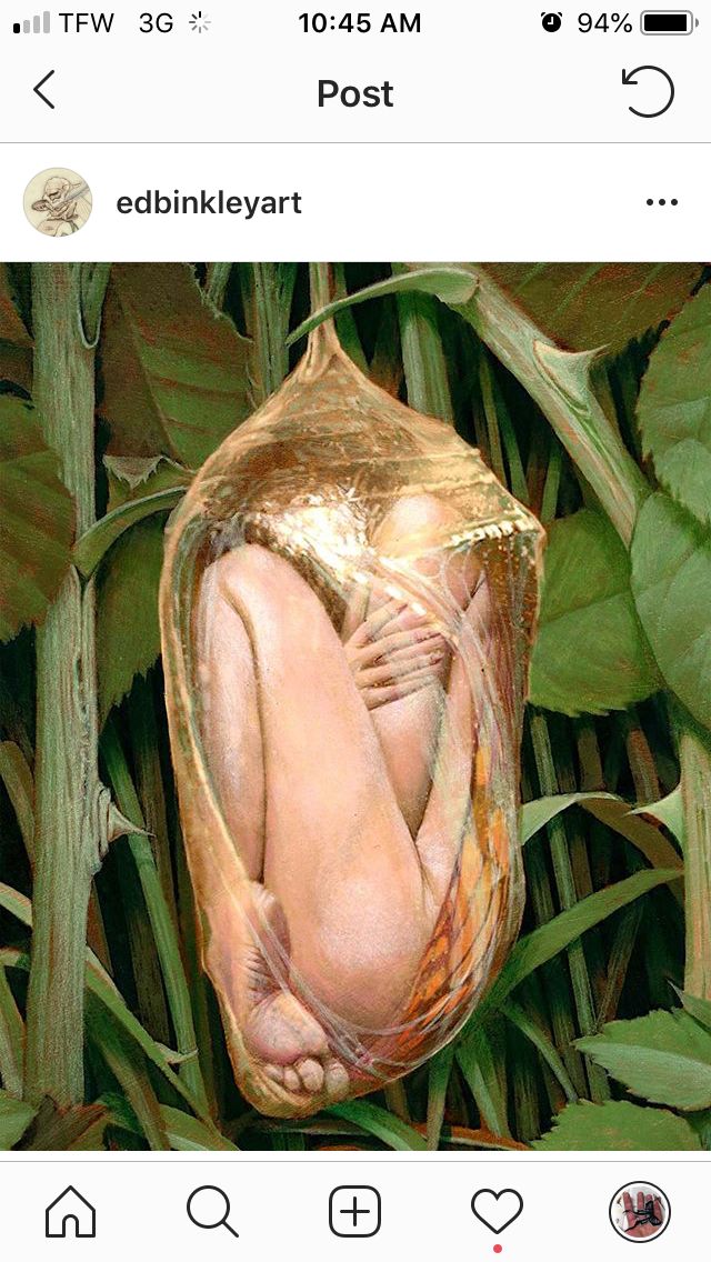 an image of a nude woman wrapped in foil on top of green plants and leaves