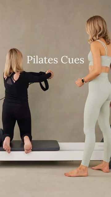 two women in black and white bodysuits standing on a bed with the caption pilates cues