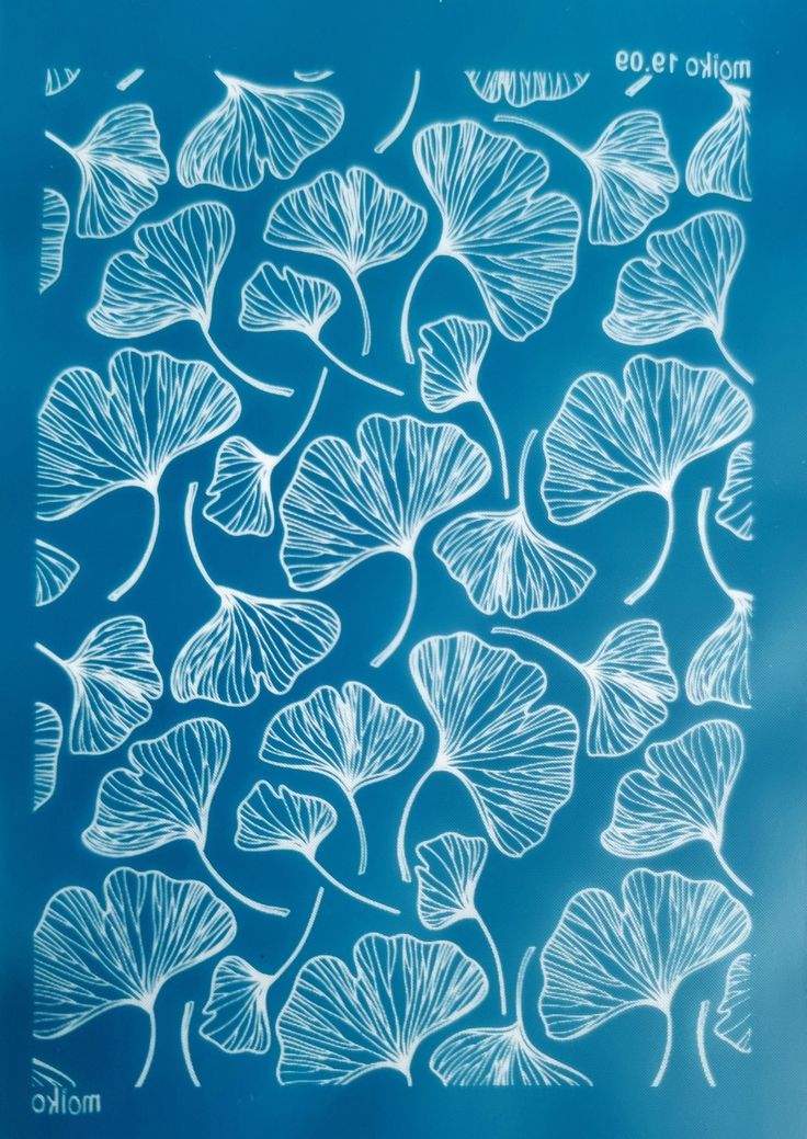 a blue poster with white flowers on it