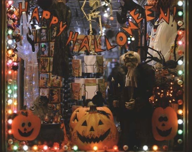 a window display with halloween decorations and lights