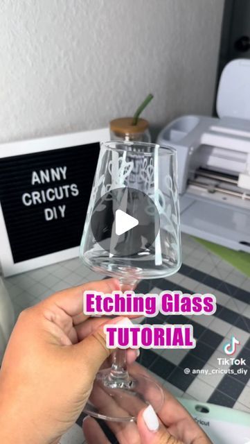 a person holding a wine glass with the words etcting glass tutorial on it