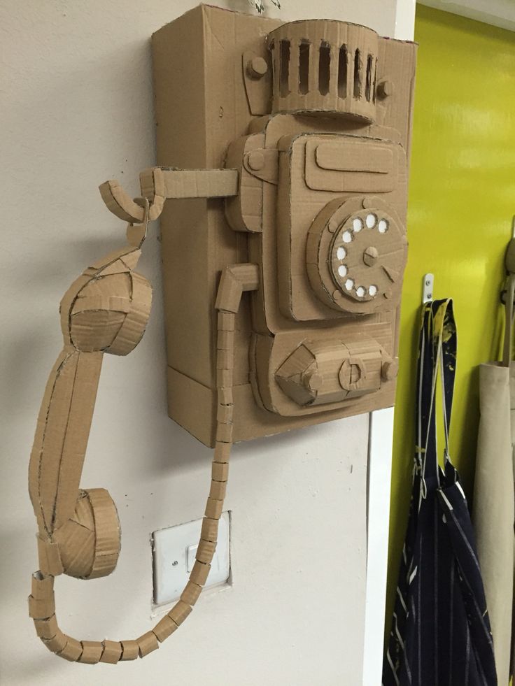 an old fashioned telephone made out of cardboard