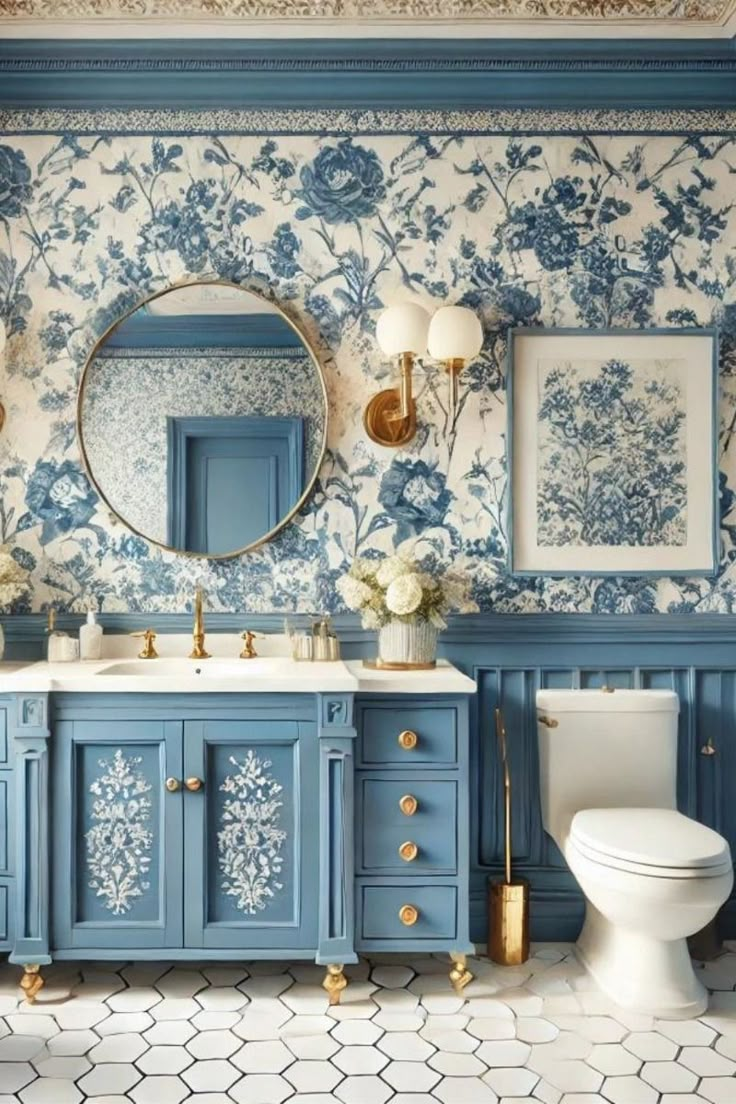 a blue and white bathroom with gold accents