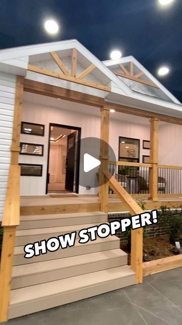 a house with the words show stopper on it's front porch and stairs