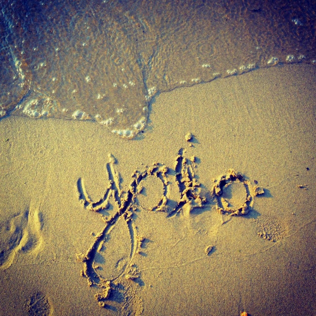 the word joy written in the sand at the beach