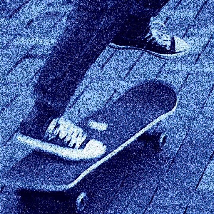 a person standing on top of a skateboard