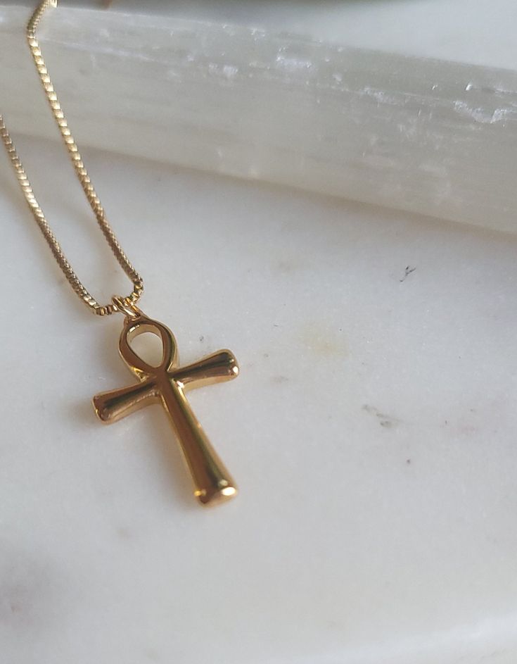 Ankh pendant necklace + adjustable link Ankh [the key of life] Box necklace style 18k plated Water friendly Gold Egyptian Jewelry, Spiritual Crucifix Necklace As Gift, Spiritual Crucifix Necklace For Gift, Spiritual Gold Plated Cross Pendant Necklace, Gold Plated Cross Pendant Necklace Spiritual Style, Gold Plated Cross Pendant Necklace With Spiritual Style, Spiritual Cross Pendant Necklaces For Gift, Spiritual Cross Pendant Necklace For Gift, Gift Crucifix Necklace With Clavicle Chain