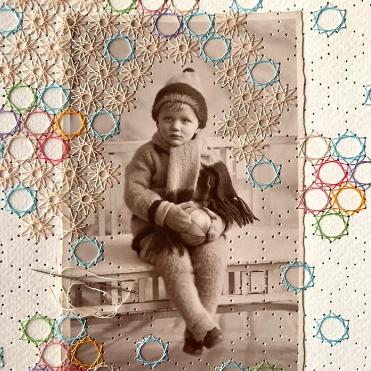 an old photo of a young boy sitting on a bench with a hat and scarf around his neck