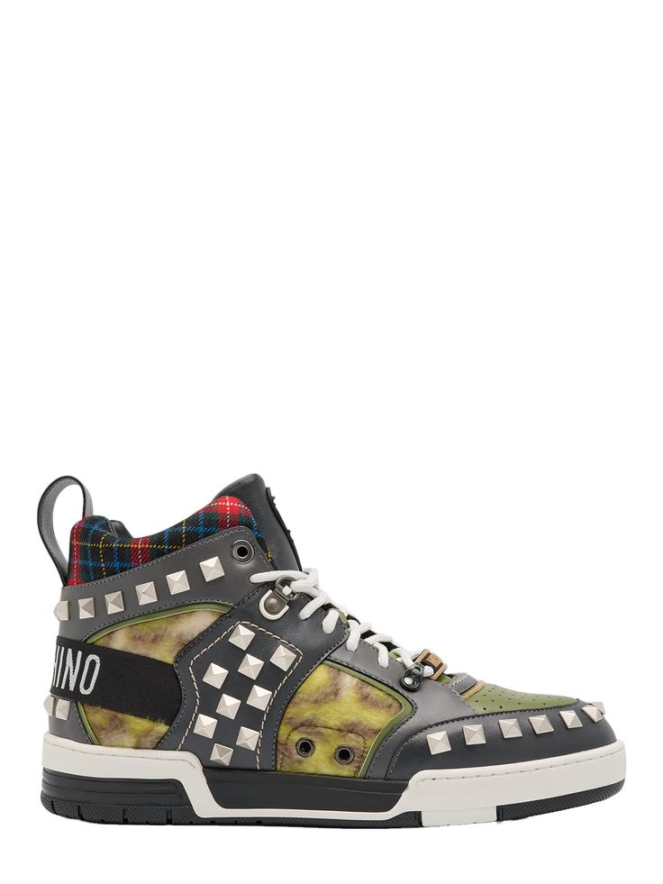 "Find MOSCHINO Streetball Mixed-media High-top Sneakers on Editorialist. Moschino \"Streetball\" sneakers featuring mixed patterns, leather trims and pyramid studs Flat heel Round toe Laceup vamp Pulltab at backstay Rubber outsole Made in Italy" Mixed Patterns, Studded Flats, Pattern Mixing, Mens Shoes Sneakers, Pyramid, Leather Trims, Moschino, High Top, Top Sneakers