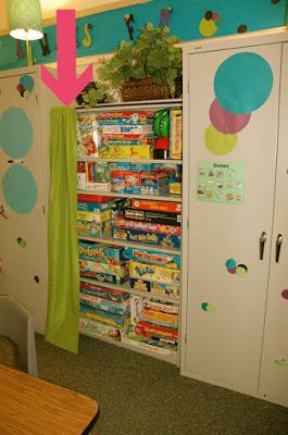 a room with a bookcase and some books on the wall next to a table