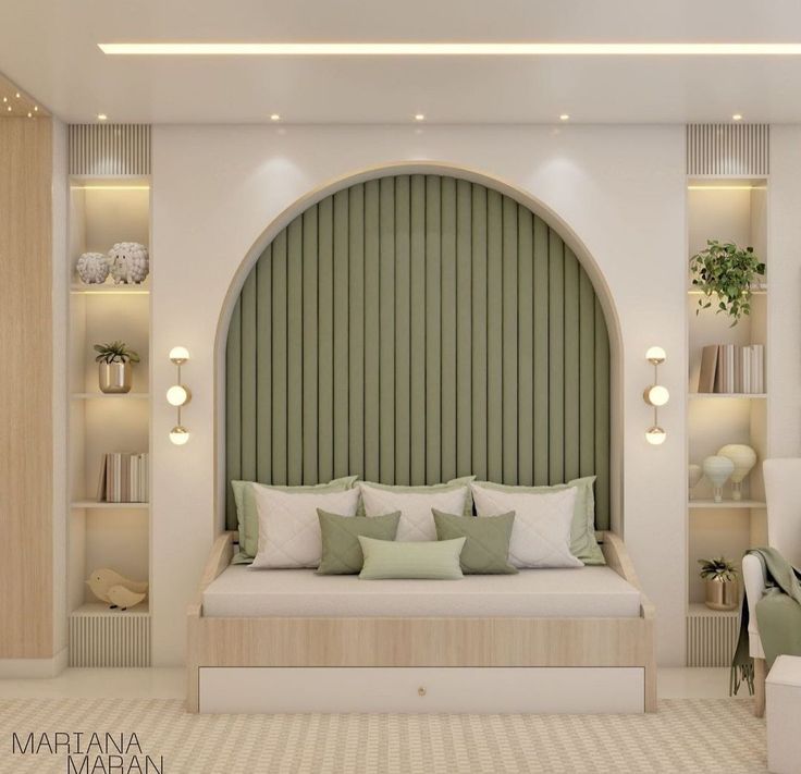 a bed sitting in the middle of a living room next to a wall mounted book shelf