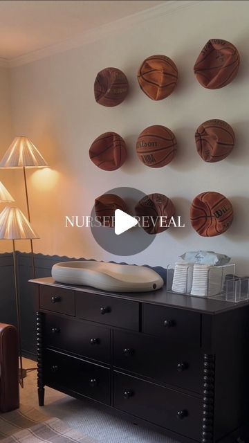 a living room filled with furniture and basketballs on the wall