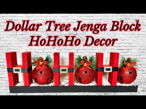 three red christmas balls sitting on top of a shelf next to a brick wall with the words dollar tree lenga block holo decor