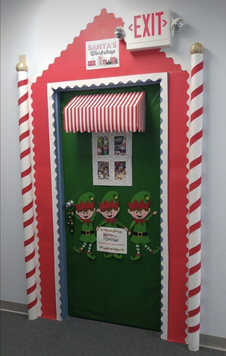 an elf themed classroom door decorated with candy canes