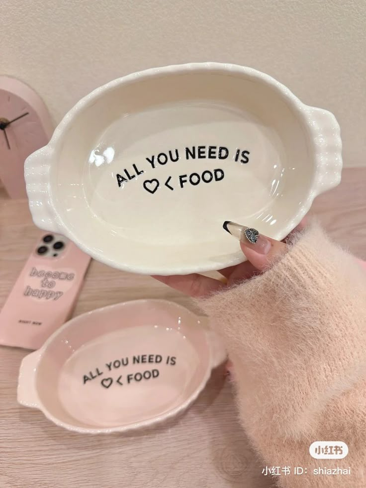 someone is holding up a bowl that says, all you need is o'food