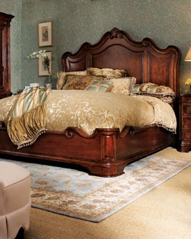 a bedroom with a large bed, dresser and chair in the corner on carpeted flooring