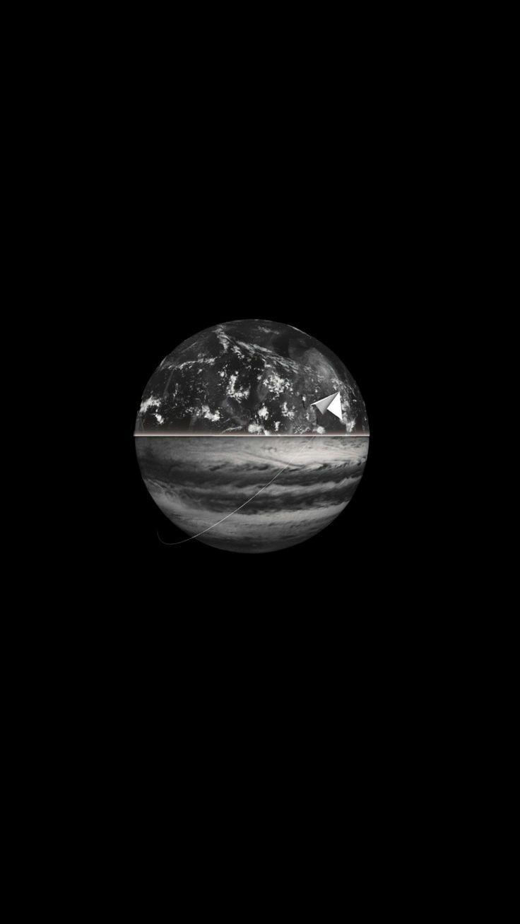 an image of the earth taken from space in black and white, with some light on it