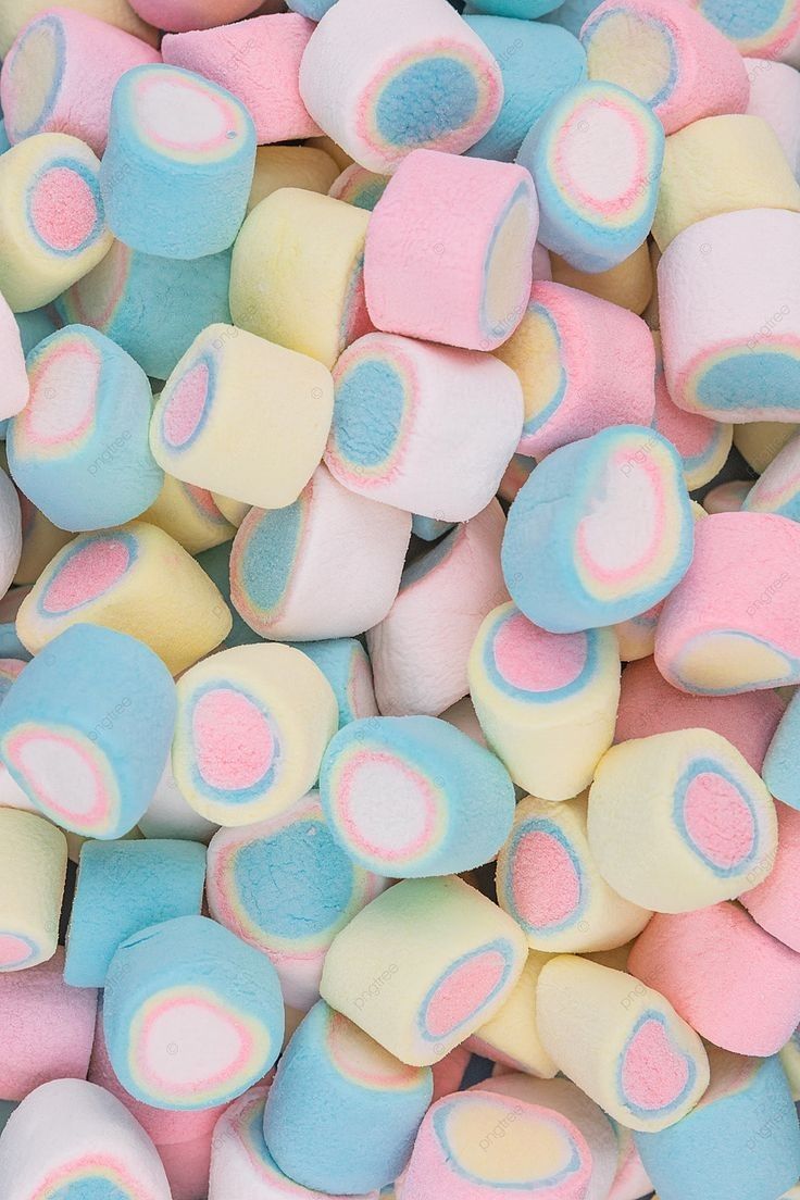 marshmallows in pastel colors are scattered on top of each other