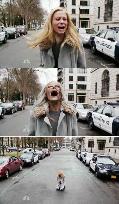 a woman with her mouth open standing in the middle of a street