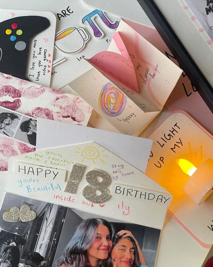 a table topped with lots of different types of greeting cards and paper crafts on top of each other