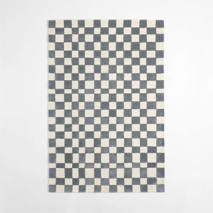 a black and white checkered rug on a wall