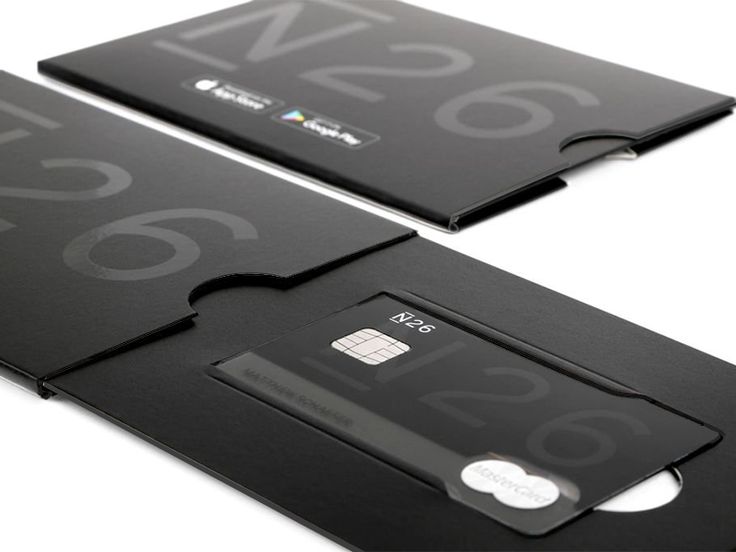 two black cards with numbers on them sitting next to each other in front of a white background